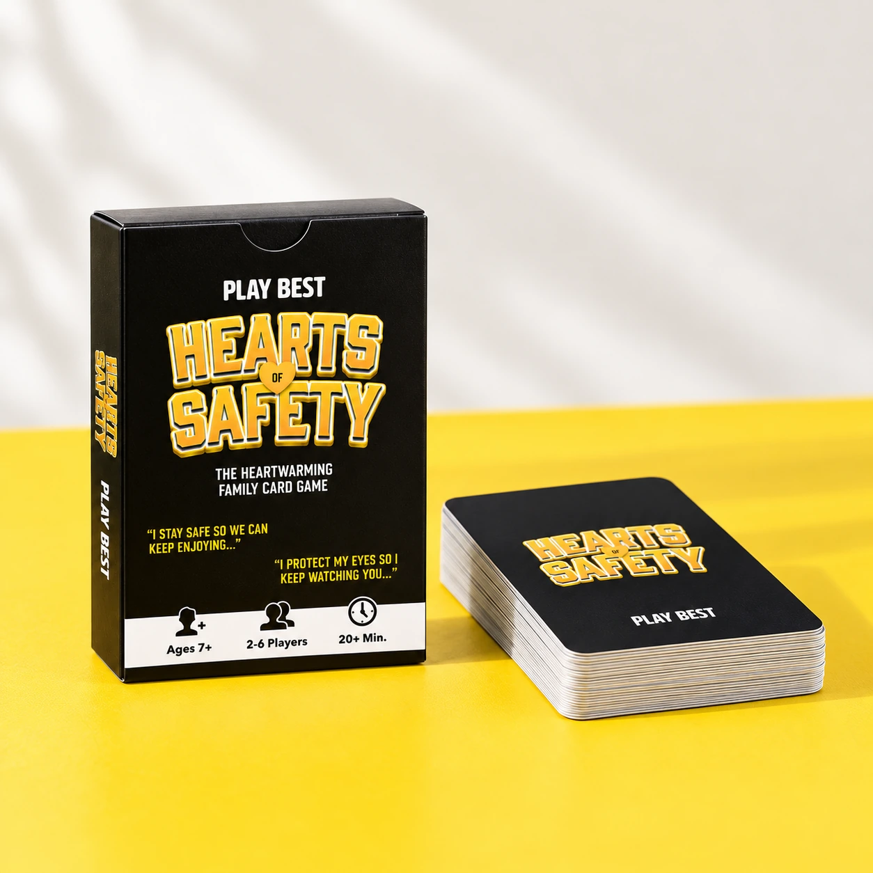 Hearts of Safety box and card deck on a yellow tabletop